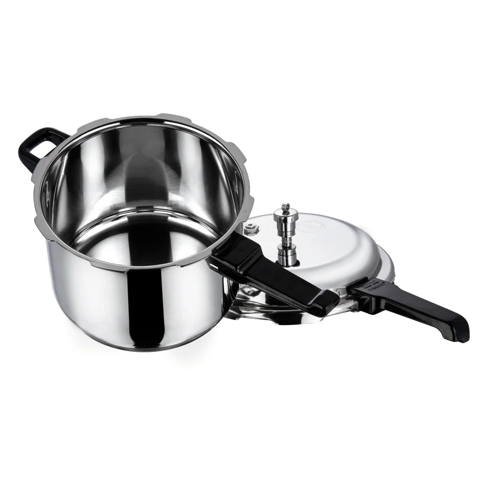 Stainless steel pressure cooker on a white background