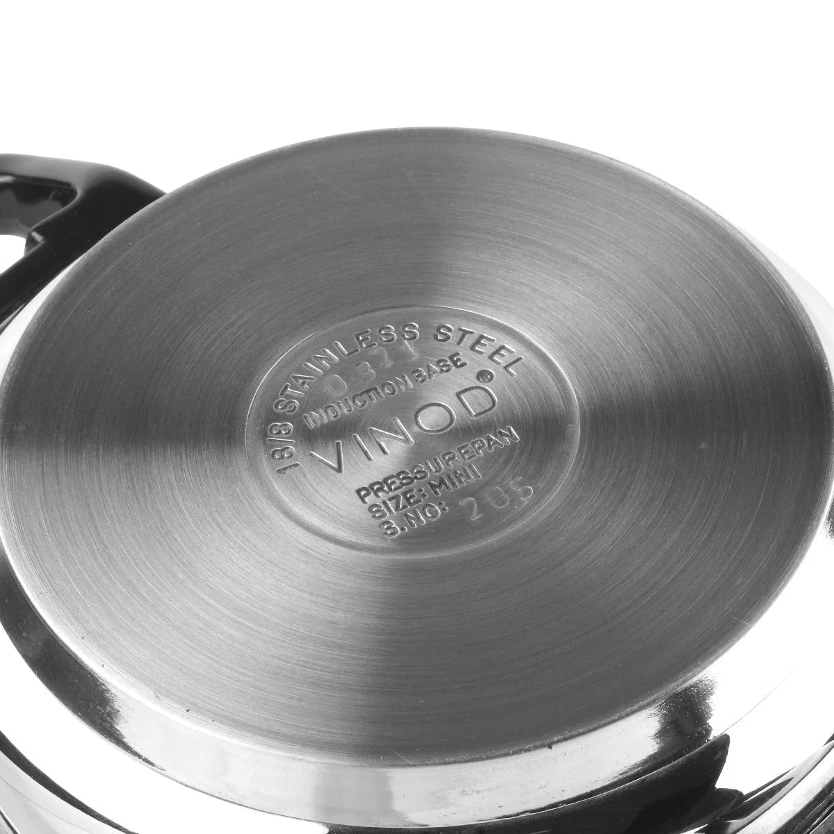 Bottom of a stainless steel pressure cooker with 'VINOD' branding 