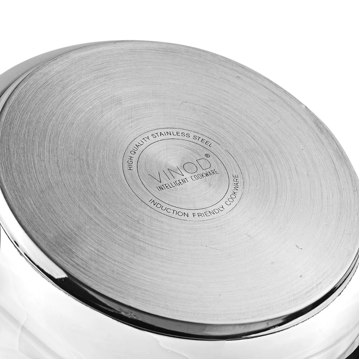 Stainless steel pressure cooker bottom view with 'VINOD' branding on a white background