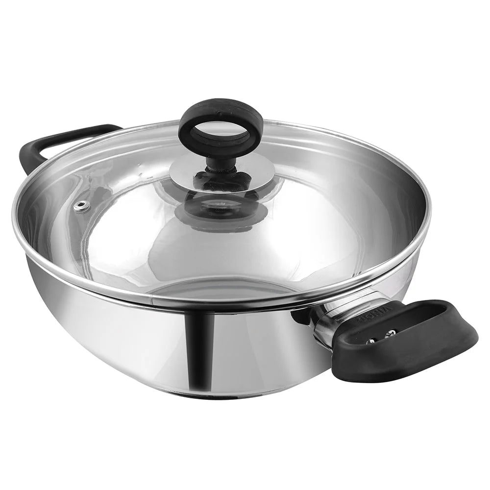 Vinod Deluxe stainless steel kadai with closed toughened glass lid, highlighting its compatibility with induction cooktops