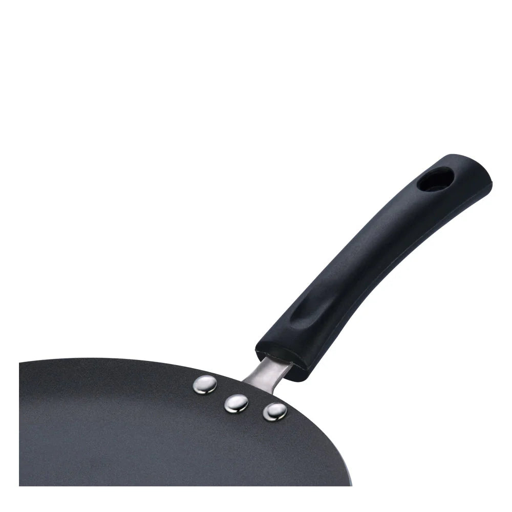 Vinod concave Black Tawa pan with a handle on a white background