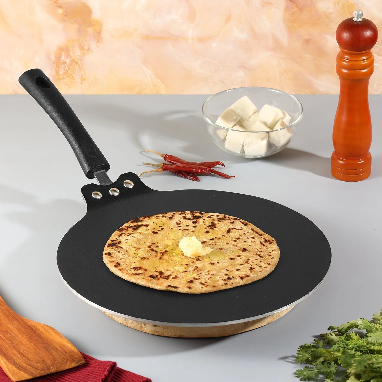 Perfect golden paratha with butter being cooked on Vinod Non-Stick Flat Multi Tawa 28cm showing excellent PFOA-free coating performance with cooking ingredients