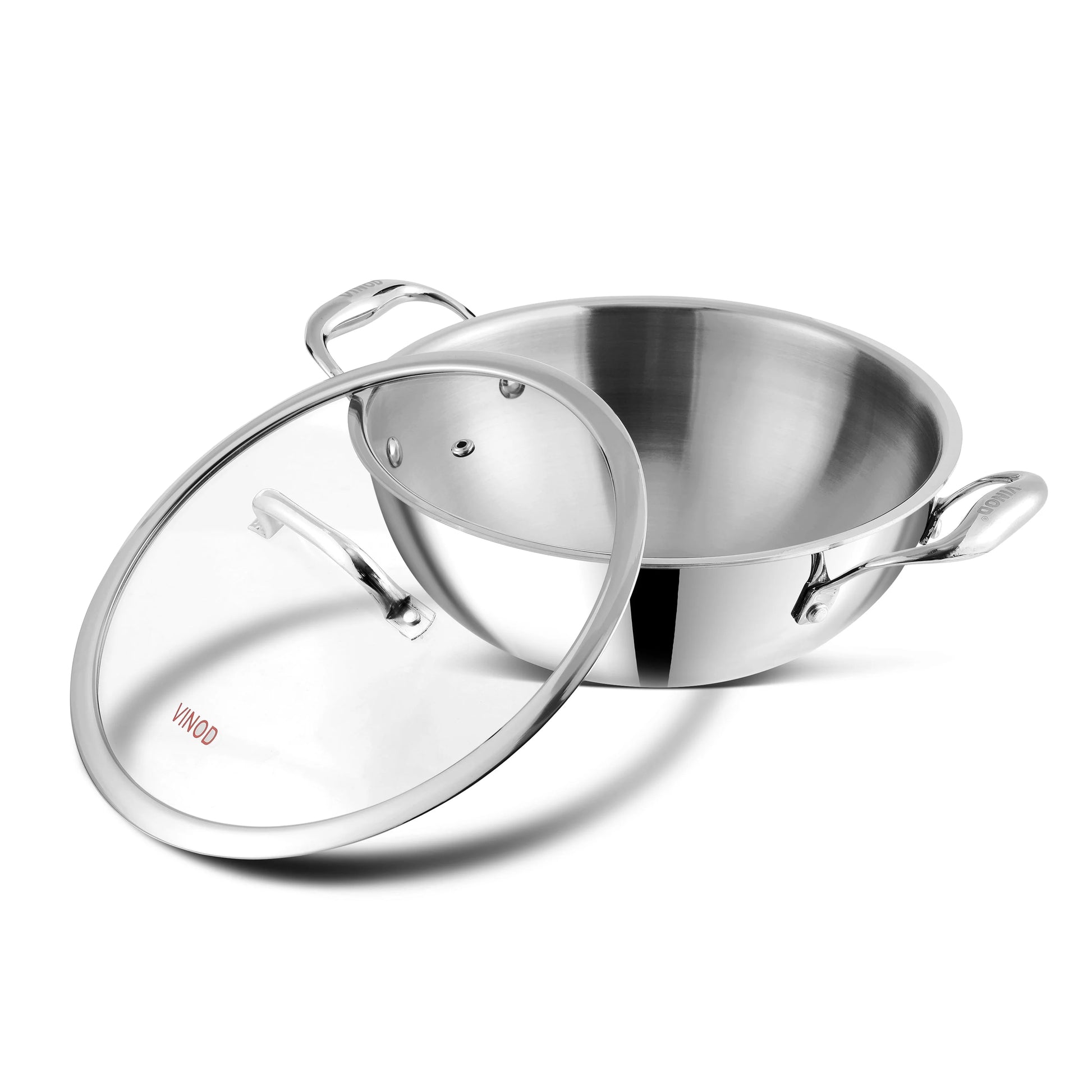 Vinod Platinum triply stainless steel kadai with open glass lid showing premium interior and dual riveted handles for easy cooking and serving